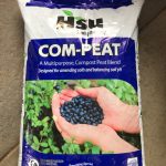 bag of compost and peat mixture, with package that reads, "Hsu growing company, com-peat, a multipurpose compost peat blend