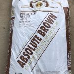 bag of mulch that reads, "Absolue Brown color enhanced mulch"